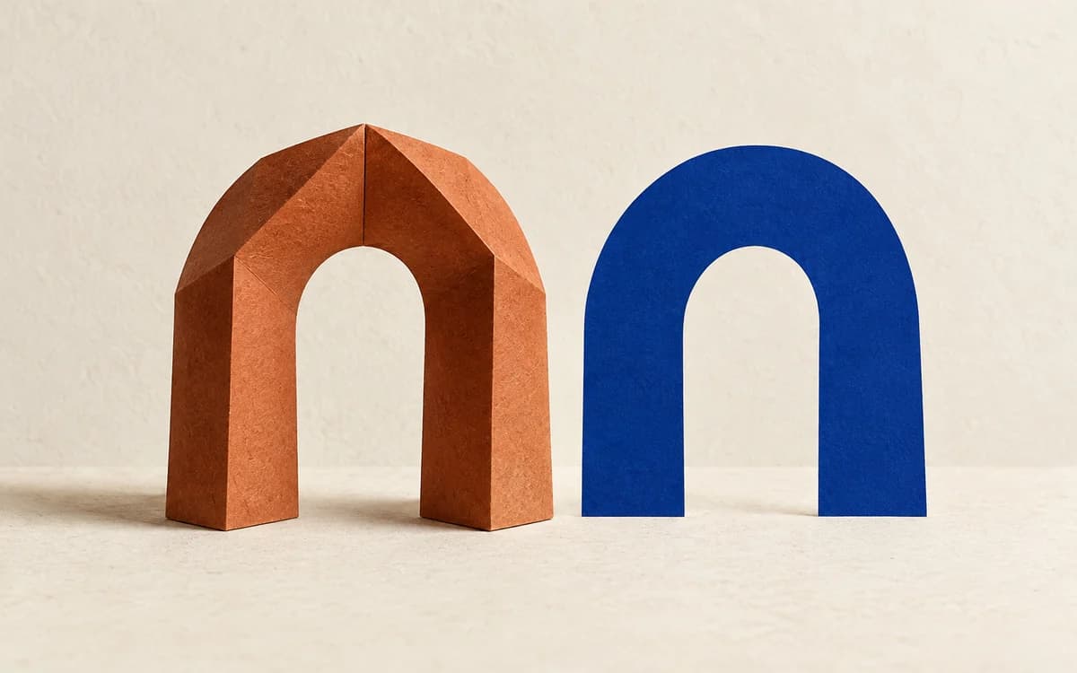 A terracotta paper arch beside a flat blue silhouette of the same shape
